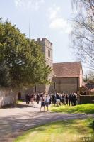 guests waiting outside a church in surrey for the wedding to begin